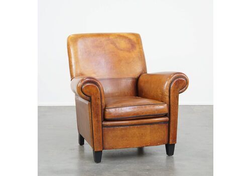 Large, Sturdy And Comfortable Vintage Cognac Colored Sheepskin Armchair Finished With Black Piping