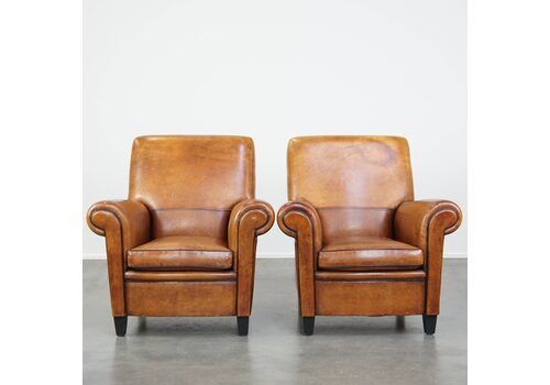 Set Of 2 Large, Sturdy And Comfortable Vintage Cognac Colored Sheepskin Armchairs/Armchairs Finished With Black Piping