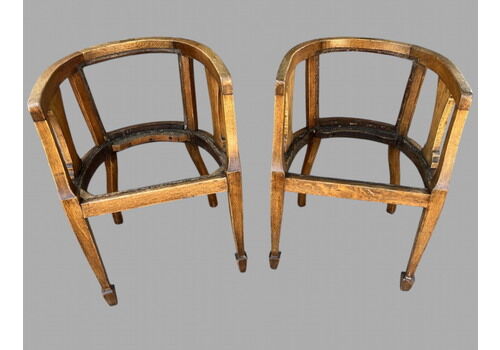 A Pair Of Edwardian Arts And Crafts Style Oak Tub Chairs