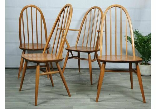 A Set Of Four Vintage Ercol Light Wood Quaker Dining Chairs Including One Carver